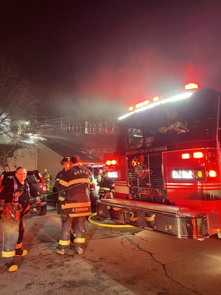 Belgium Cold Springs fire fighter crew attending to a incident scene in the dark