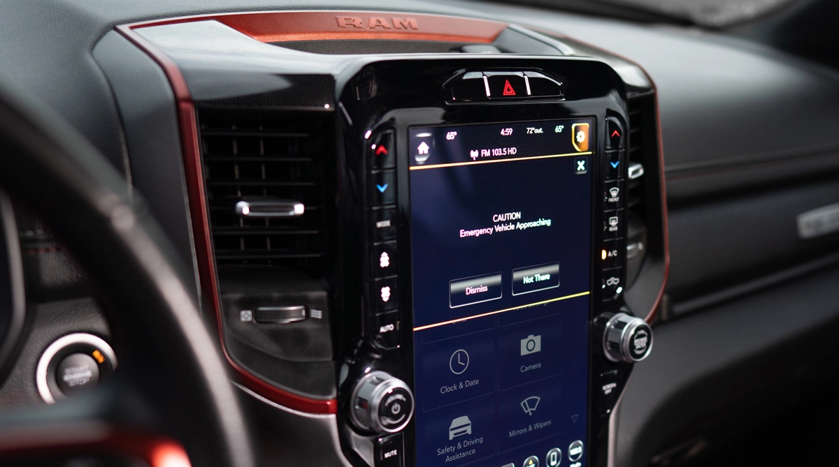 The inside display of a RAM's radio showing a car alert